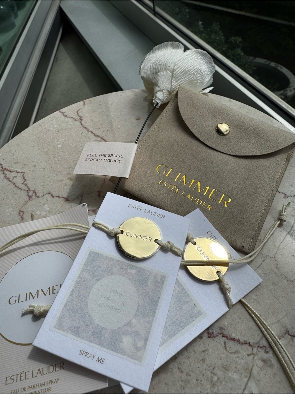 Estee Lauder Beige Travel Pouch with Gold Charm Friendship Bracelets with sample